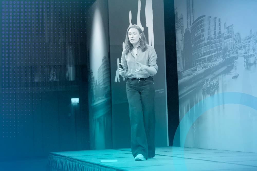 Woman on stage at spark emea keynote